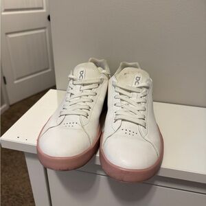 On Running White and Pink Athletic Shoes